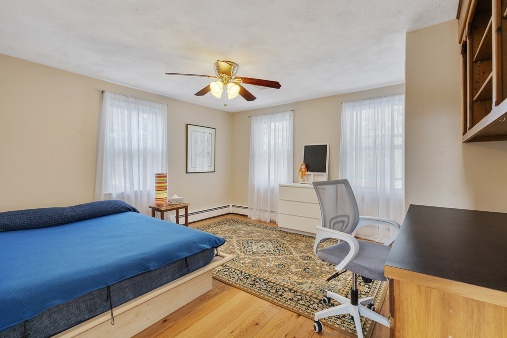 430 River Road Andover, MA 01810 - Photo 11 of 25 a bedroom with a bed and flat screen tv