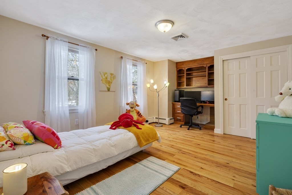 430 River Road Andover, MA 01810 - Photo 12 of 25 a bedroom with a bed and a window