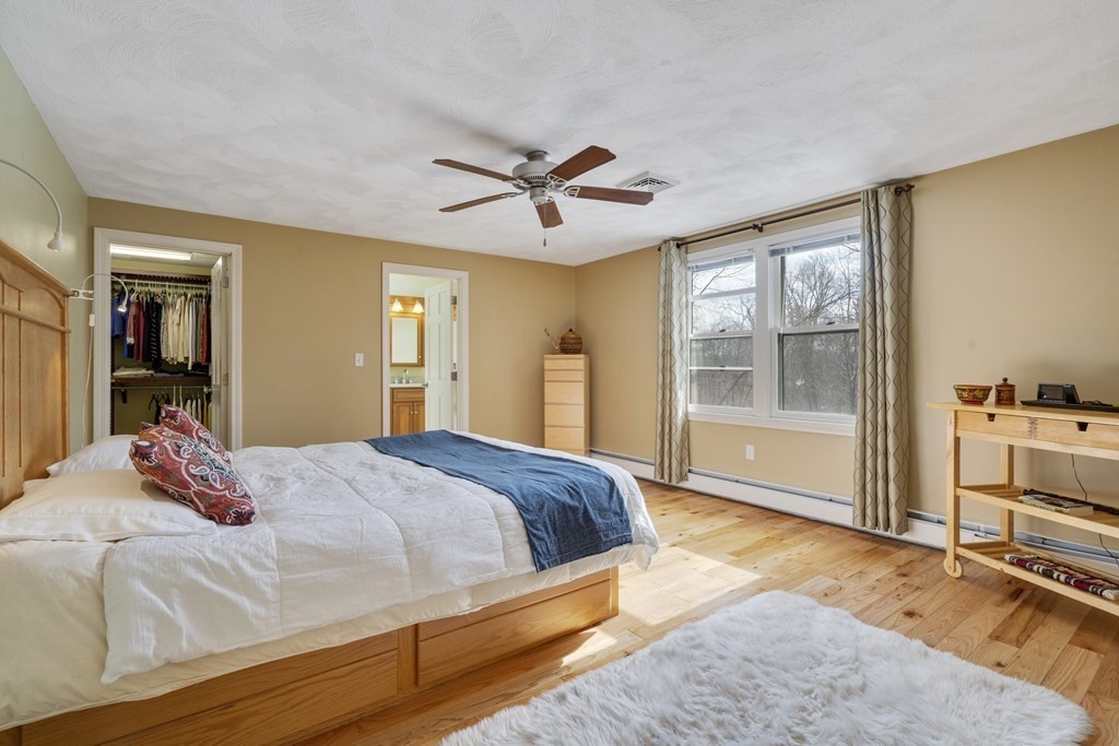 430 River Road Andover, MA 01810 - Photo 13 of 25 a bedroom with a bed and dresser with wooden floor