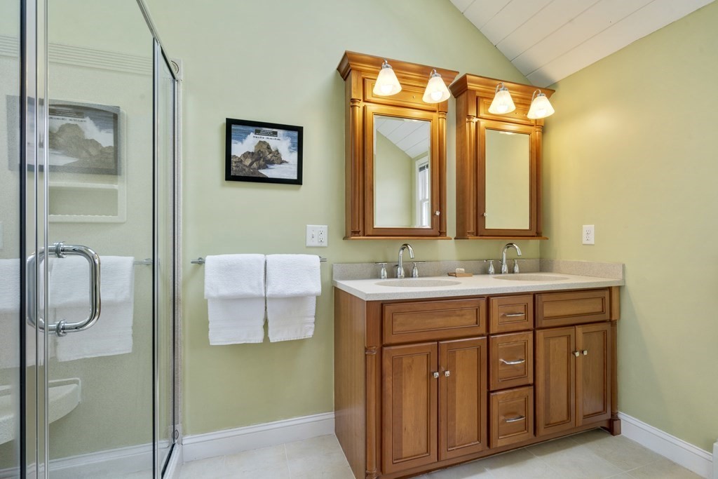 430 River Road Andover, MA 01810 - Photo 14 of 25 a bathroom with a double vanity sink and mirror