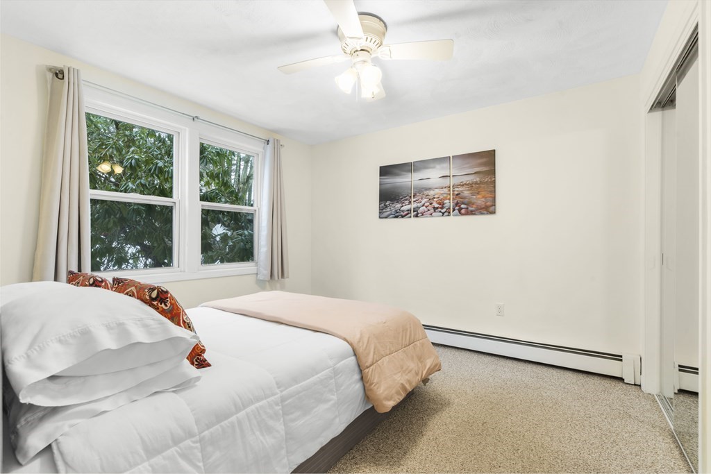 430 River Road Andover, MA 01810 - Photo 17 of 25 a bedroom with a bed and a large window