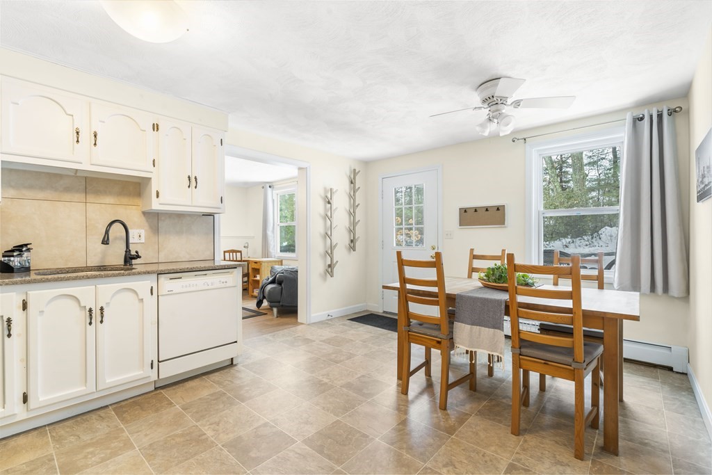 430 River Road Andover, MA 01810 - Photo 18 of 25 a kitchen with granite countertop lots of white cabinets and chairs