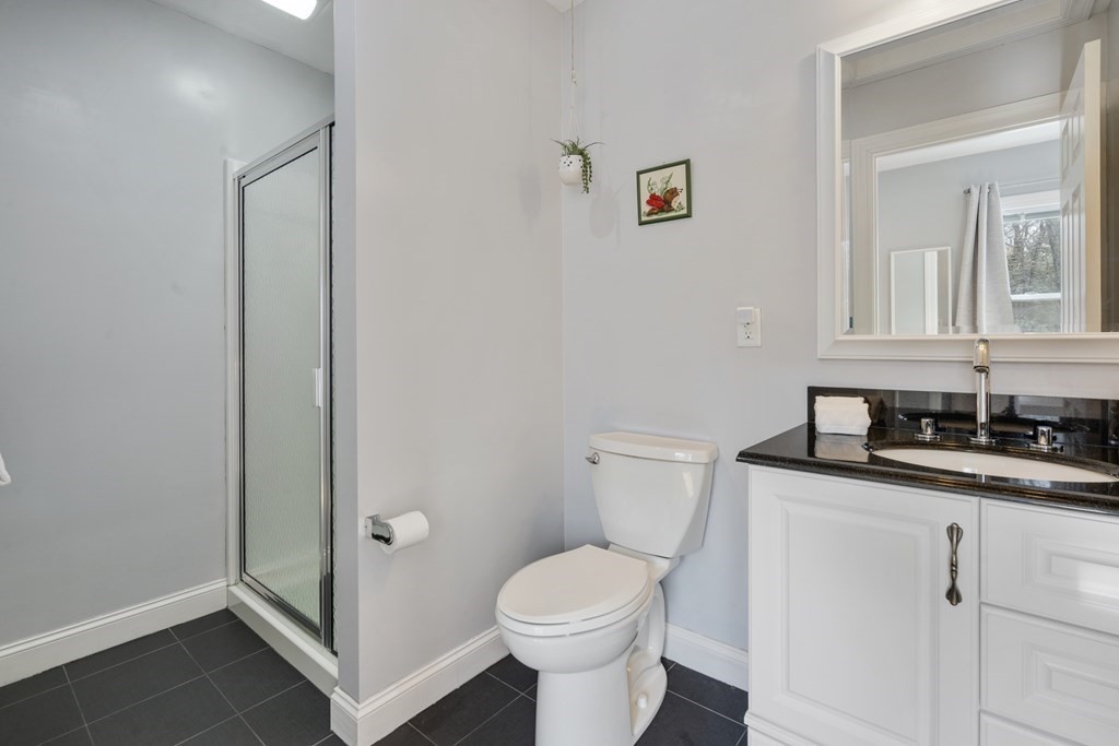 430 River Road Andover, MA 01810 - Photo 22 of 25 a white toilet sitting next to a bathroom sink