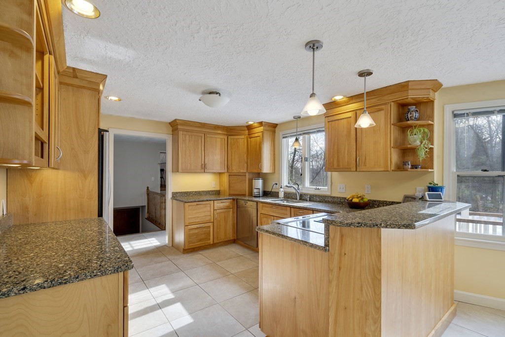 430 River Road Andover, MA 01810 - Photo 5 of 25 a kitchen with stainless steel appliances granite countertop a sink and a refrigerator