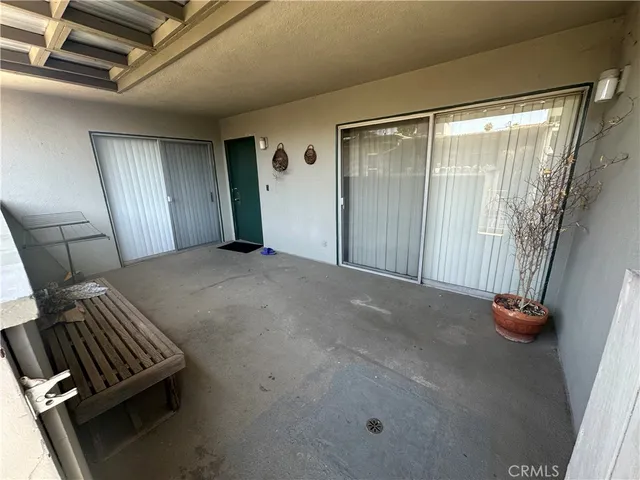 a view of an empty room and a window