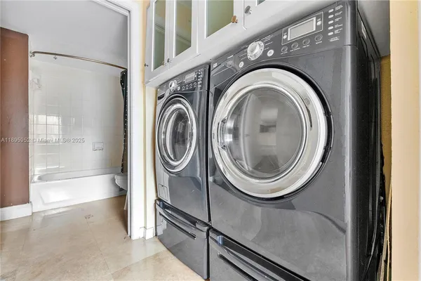 a utility room with dryer and washer