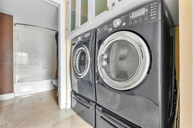 a utility room with dryer and washer