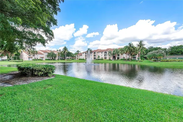 a view of a lake with a big yard