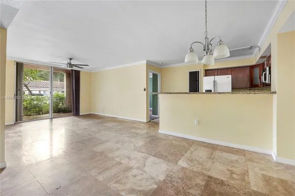 a view of a kitchen with a sink cabinets and a window