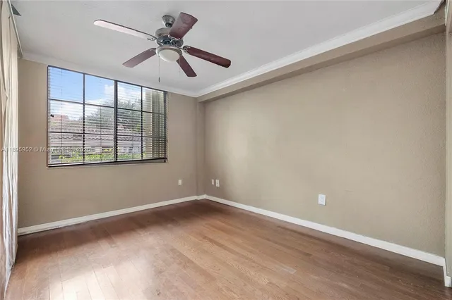 a view of room with window and ceiling fan