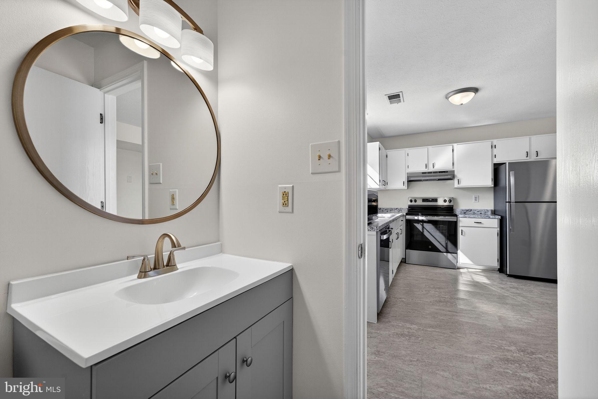 352 Valley Mill Road Winchester, VA 22602 - Photo 14 of 28 a kitchen with refrigerator and cabinets