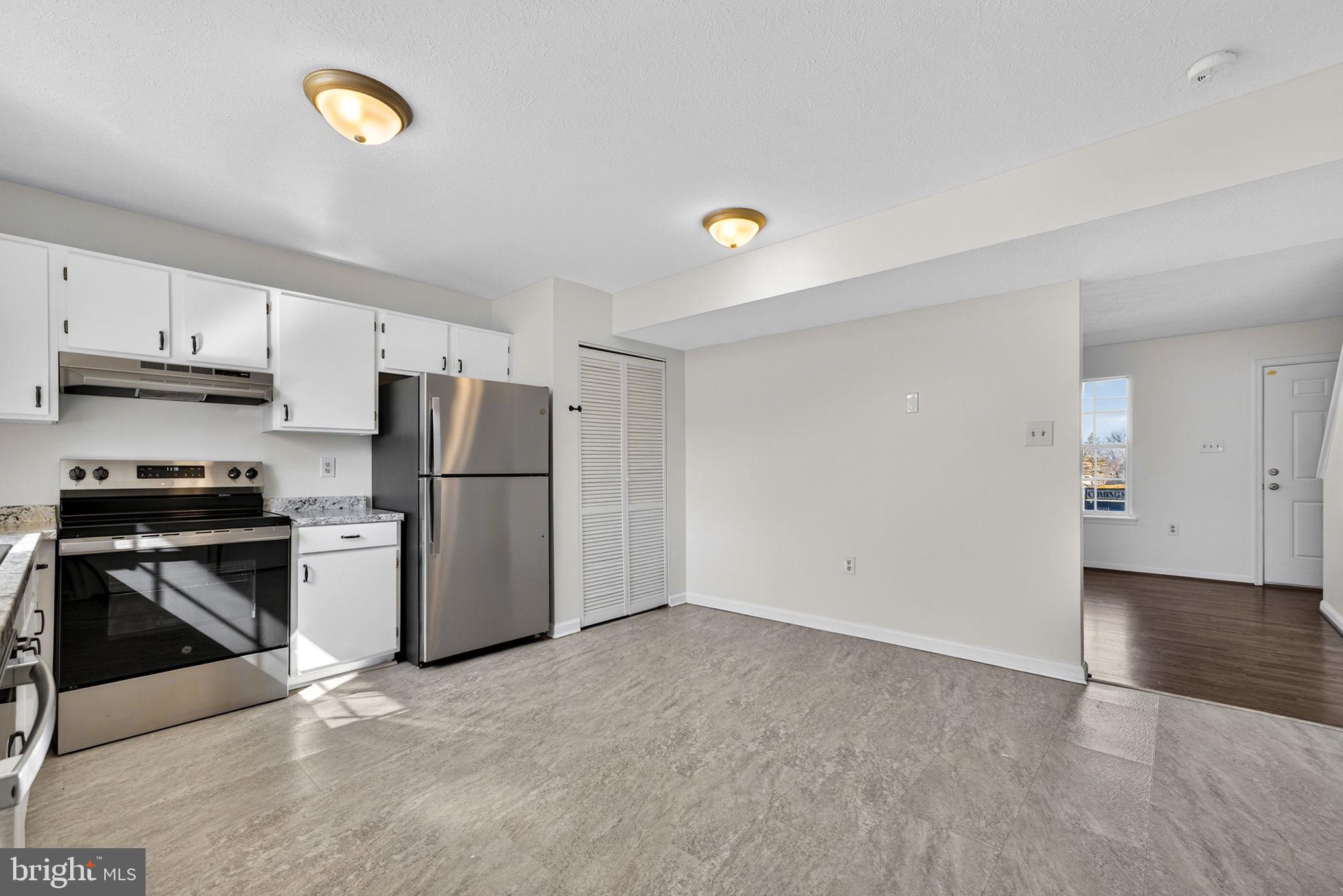 352 Valley Mill Road Winchester, VA 22602 - Photo 15 of 28 a view of a kitchen with a stove cabinets and a refrigerator
