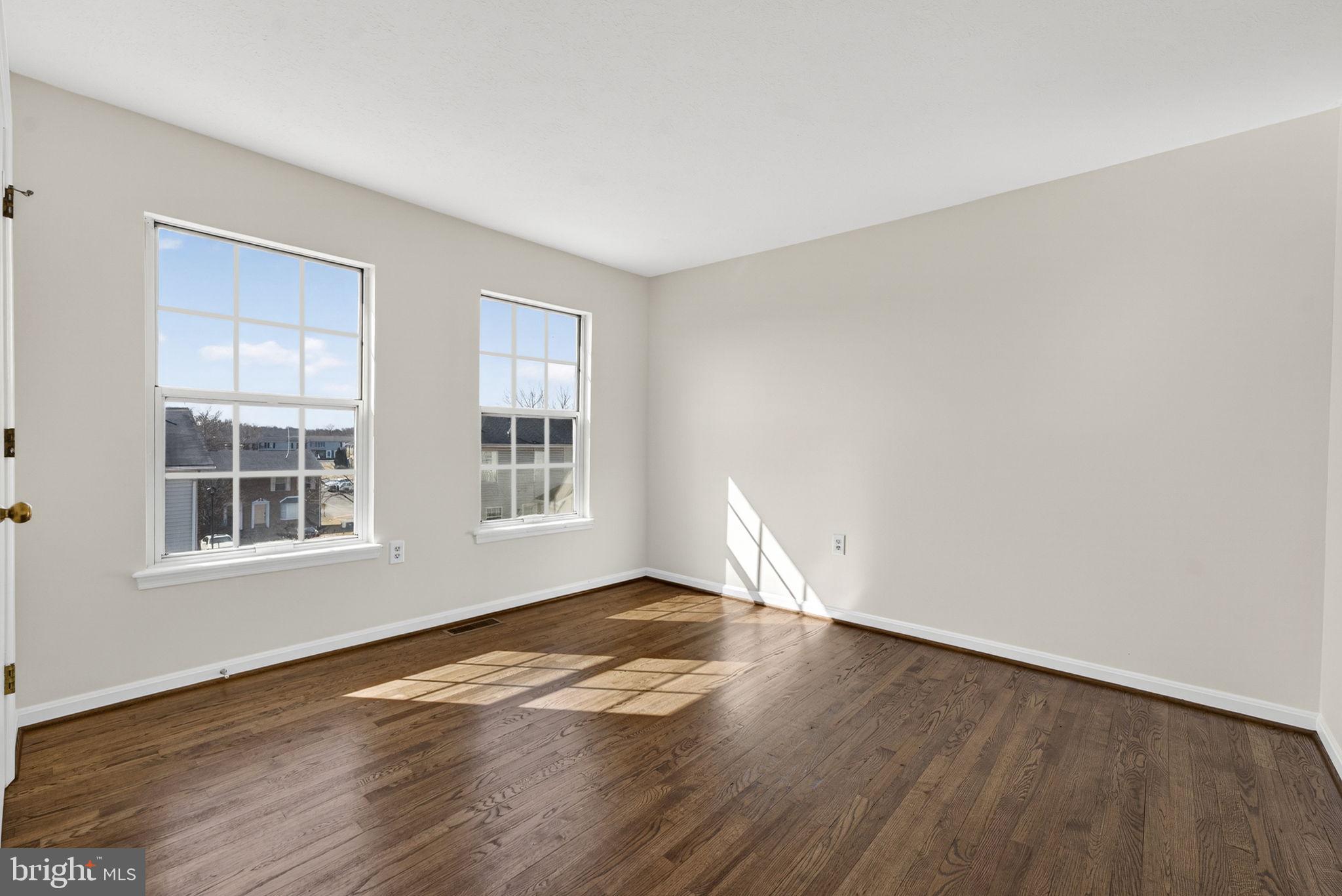 352 Valley Mill Road Winchester, VA 22602 - Photo 18 of 28 an empty room with wooden floor and windows