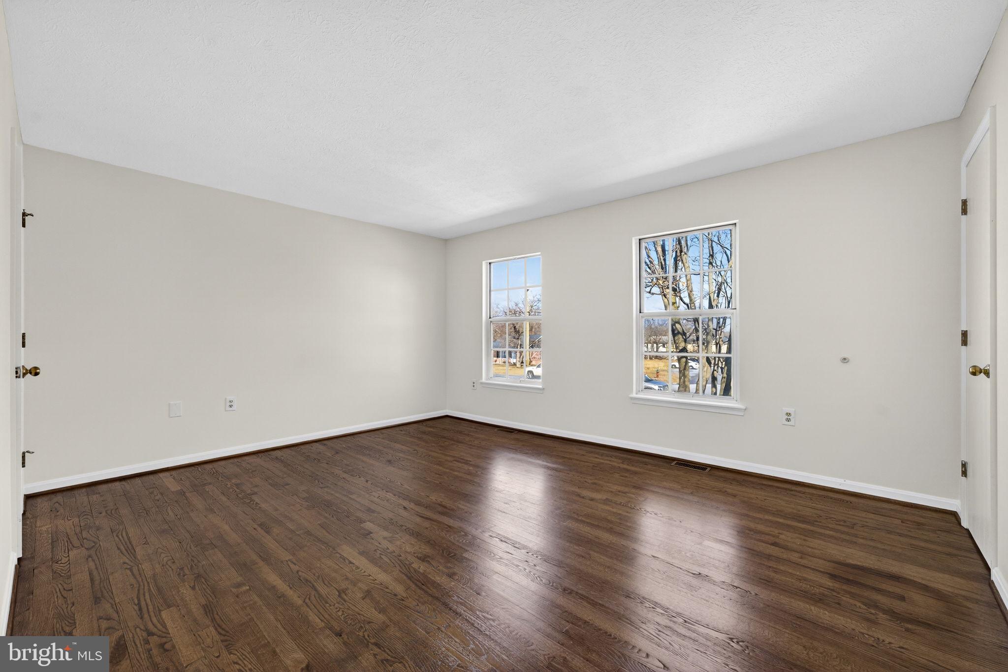 352 Valley Mill Road Winchester, VA 22602 - Photo 20 of 28 a view of an empty room with wooden floor and a window