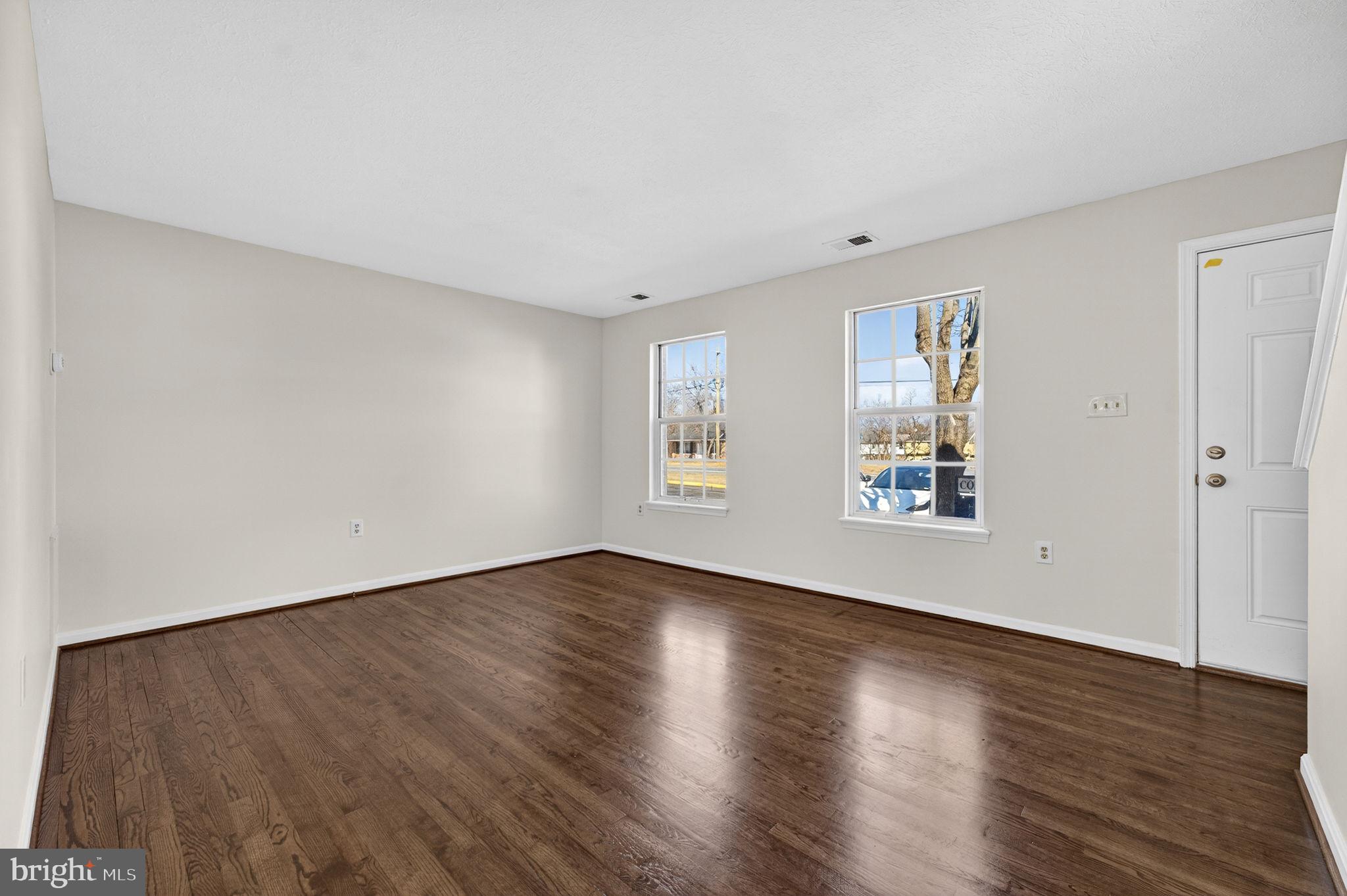 352 Valley Mill Road Winchester, VA 22602 - Photo 8 of 28 a view of an empty room with wooden floor and a window