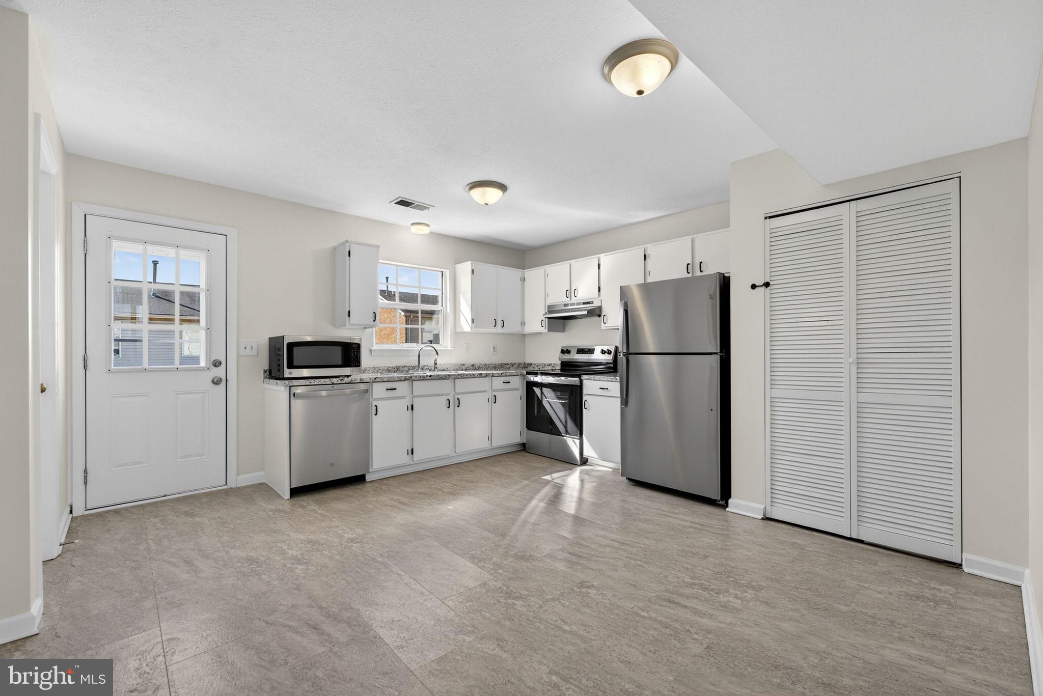 352 Valley Mill Road Winchester, VA 22602 - Photo 9 of 28 a kitchen with refrigerator a sink and cabinets