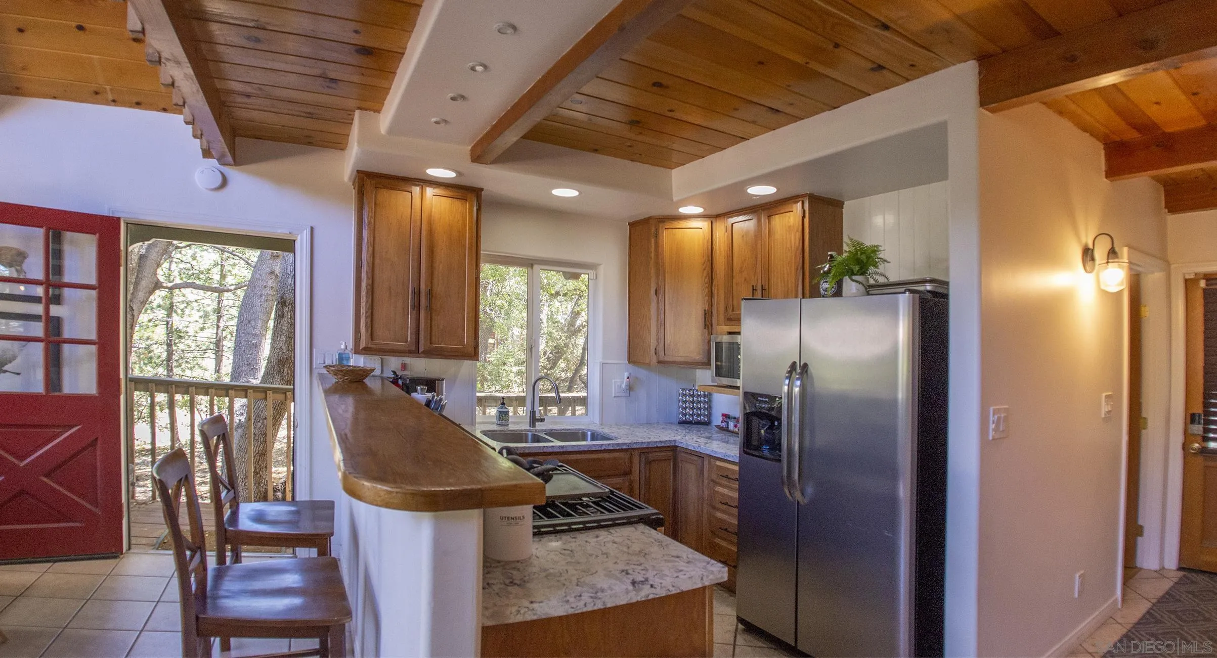 24735 Marion Ridge Drive Idyllwild, CA 92549 - Photo 11 of 29 a kitchen with refrigerator and window