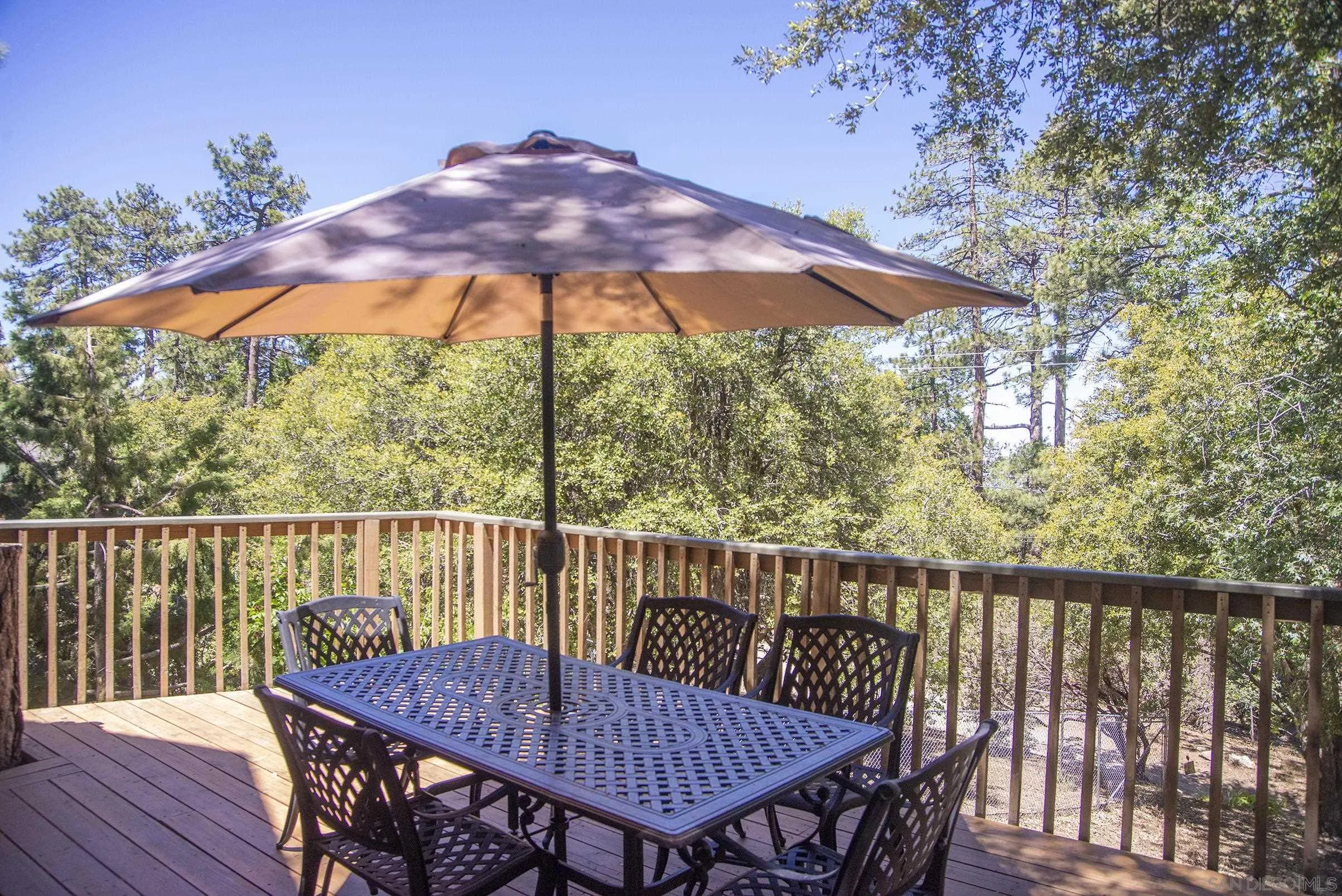 24735 Marion Ridge Drive Idyllwild, CA 92549 - Photo 15 of 29 a view of a wooden deck with furniture