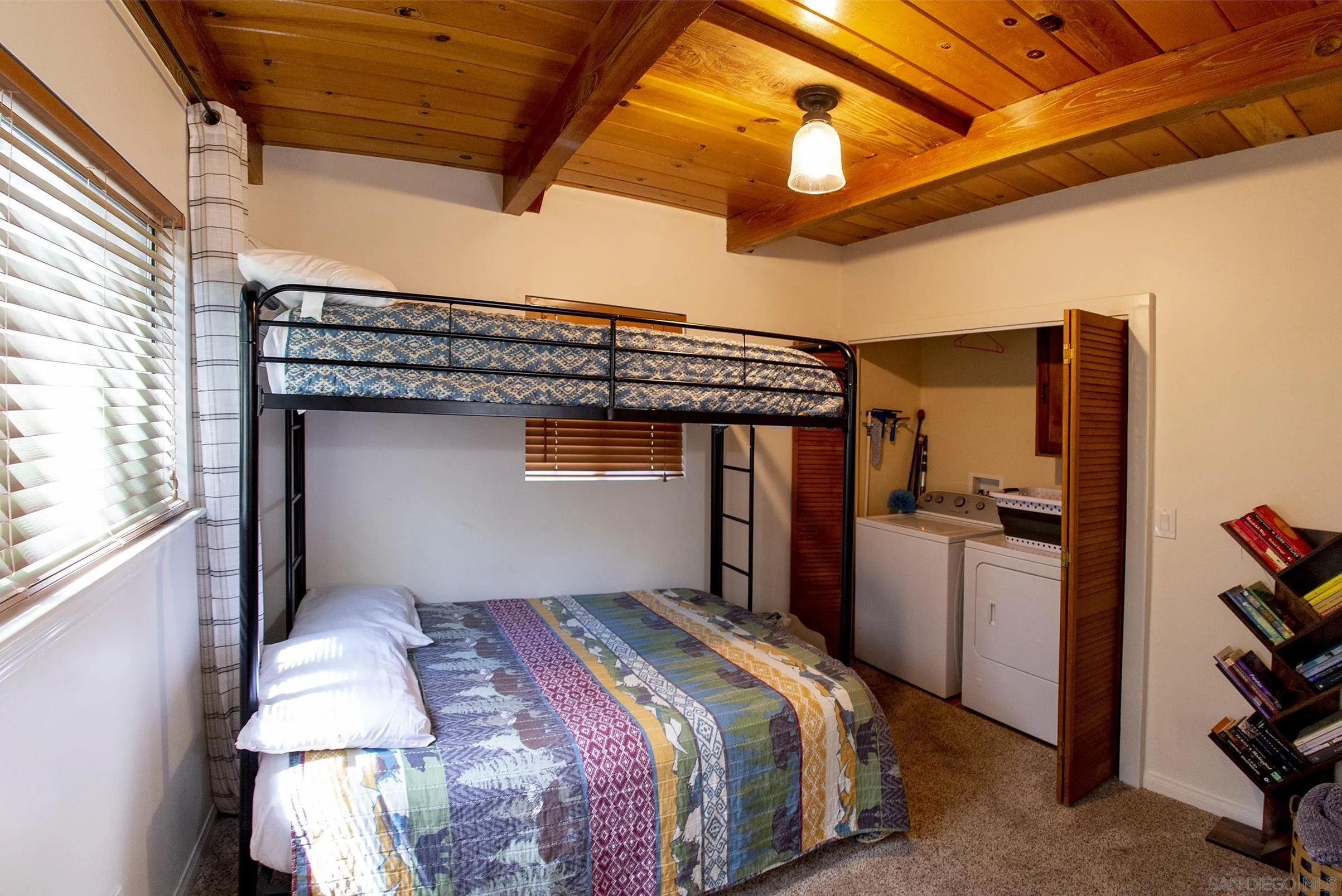 24735 Marion Ridge Drive Idyllwild, CA 92549 - Photo 24 of 29 a bedroom with a bed and a dresser