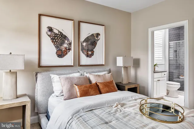 a bathroom with a double vanity sink a shower and a mirror