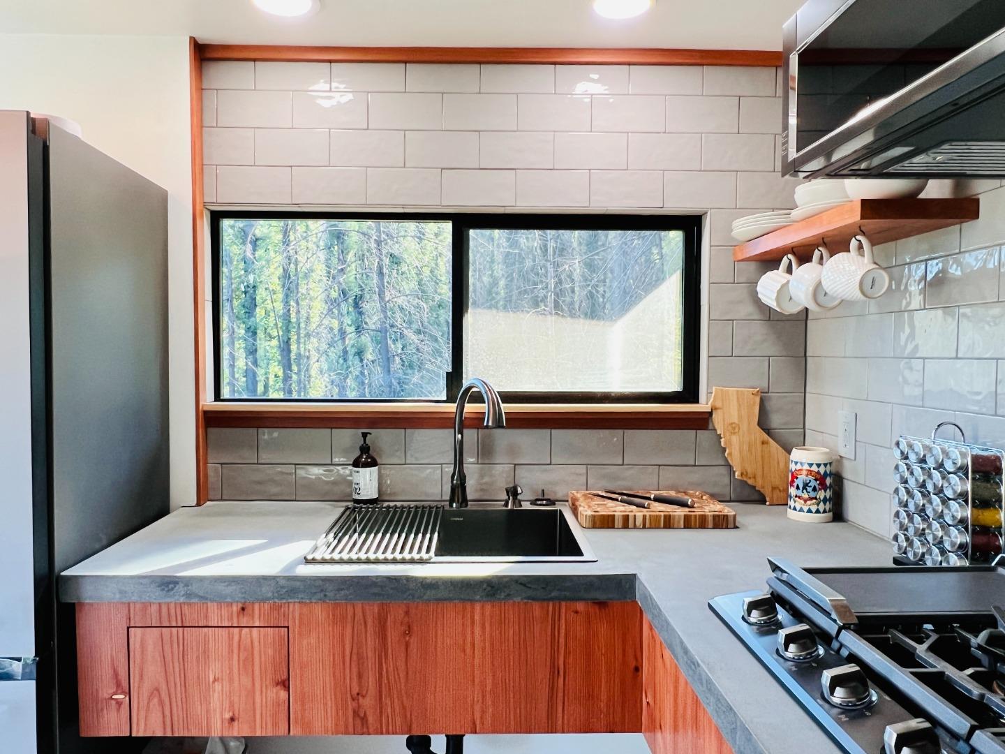 518 Container Way Boulder Creek, CA 95006 - Photo 15 of 33 a kitchen with sink a stove and a refrigerator