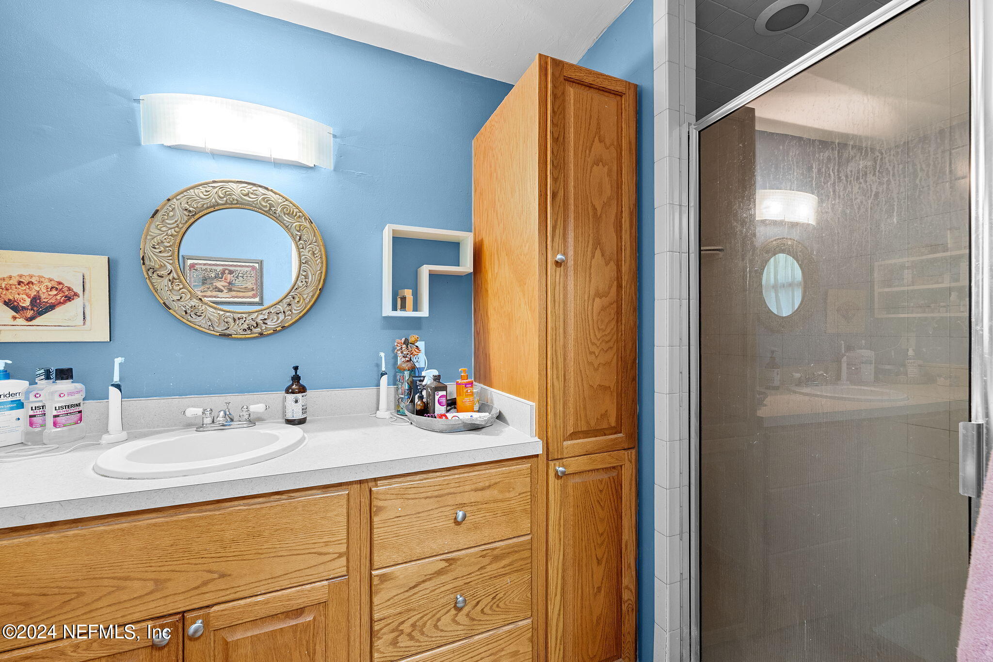 529 Fox Hollow Lane St. Augustine, FL 32086 - Photo 11 of 18 a bathroom with a sink and a mirror