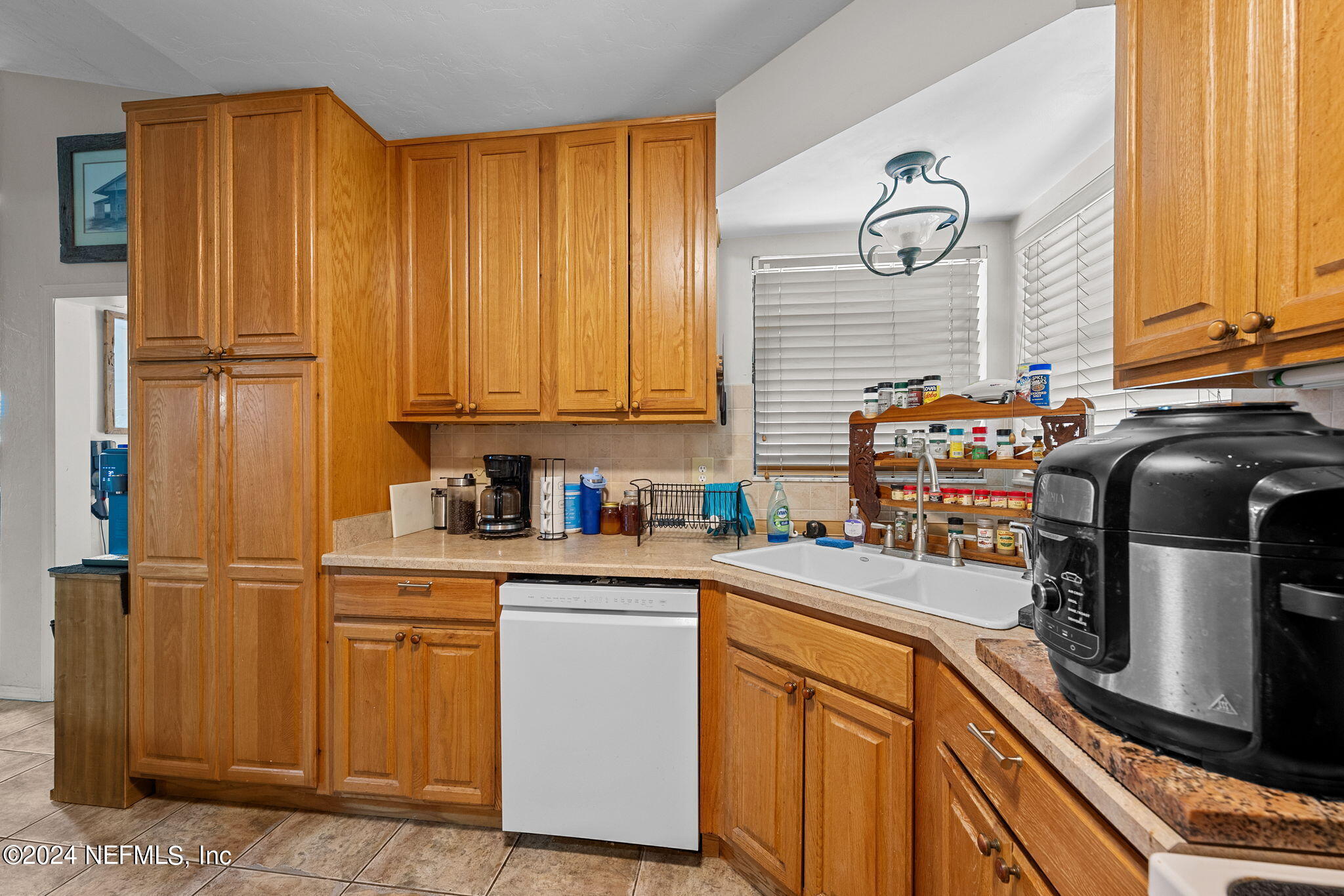 529 Fox Hollow Lane St. Augustine, FL 32086 - Photo 16 of 18 a kitchen with stainless steel appliances granite countertop a sink a stove and a refrigerator