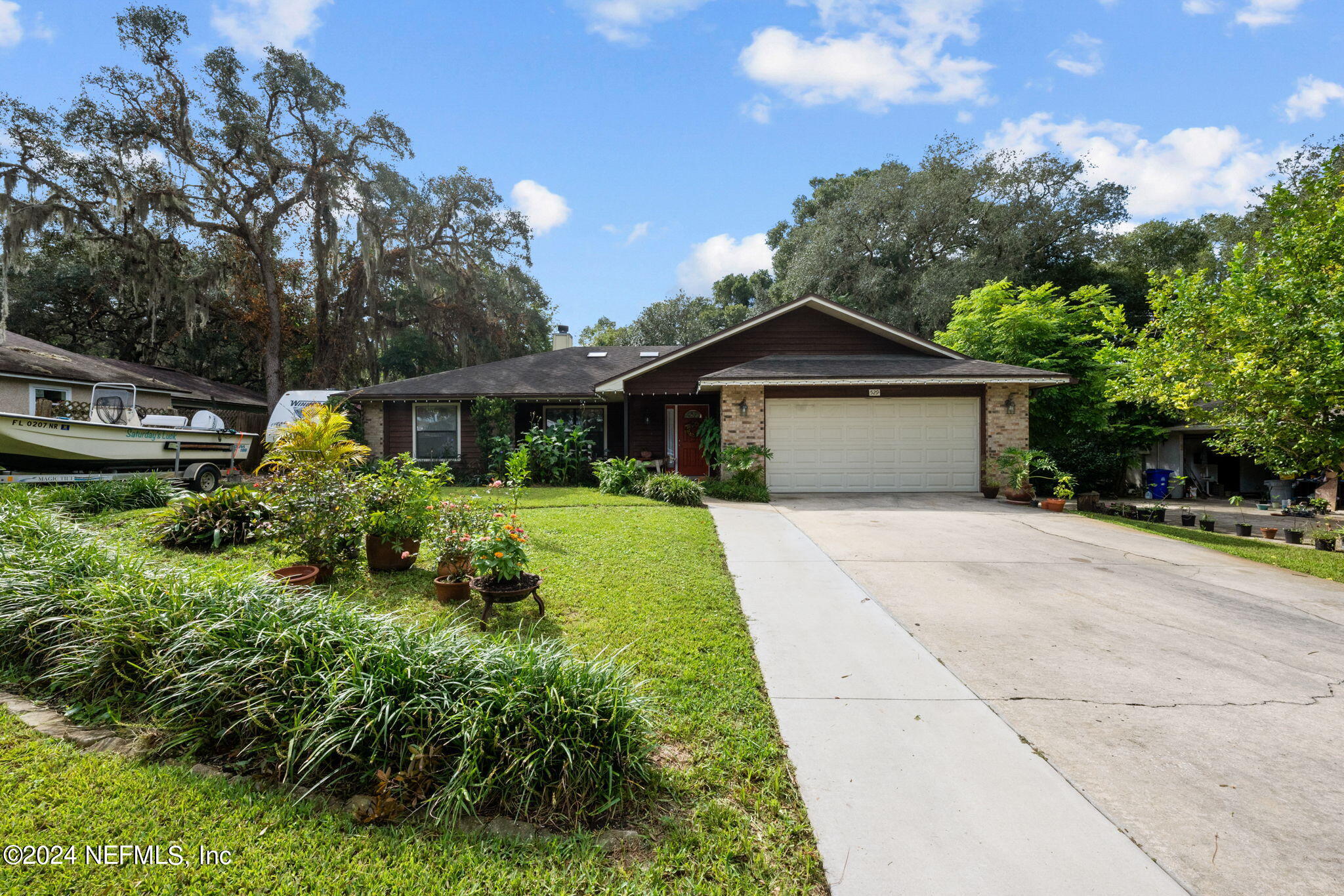 529 Fox Hollow Lane St. Augustine, FL 32086 - Photo 2 of 18 a front view of a house with garden