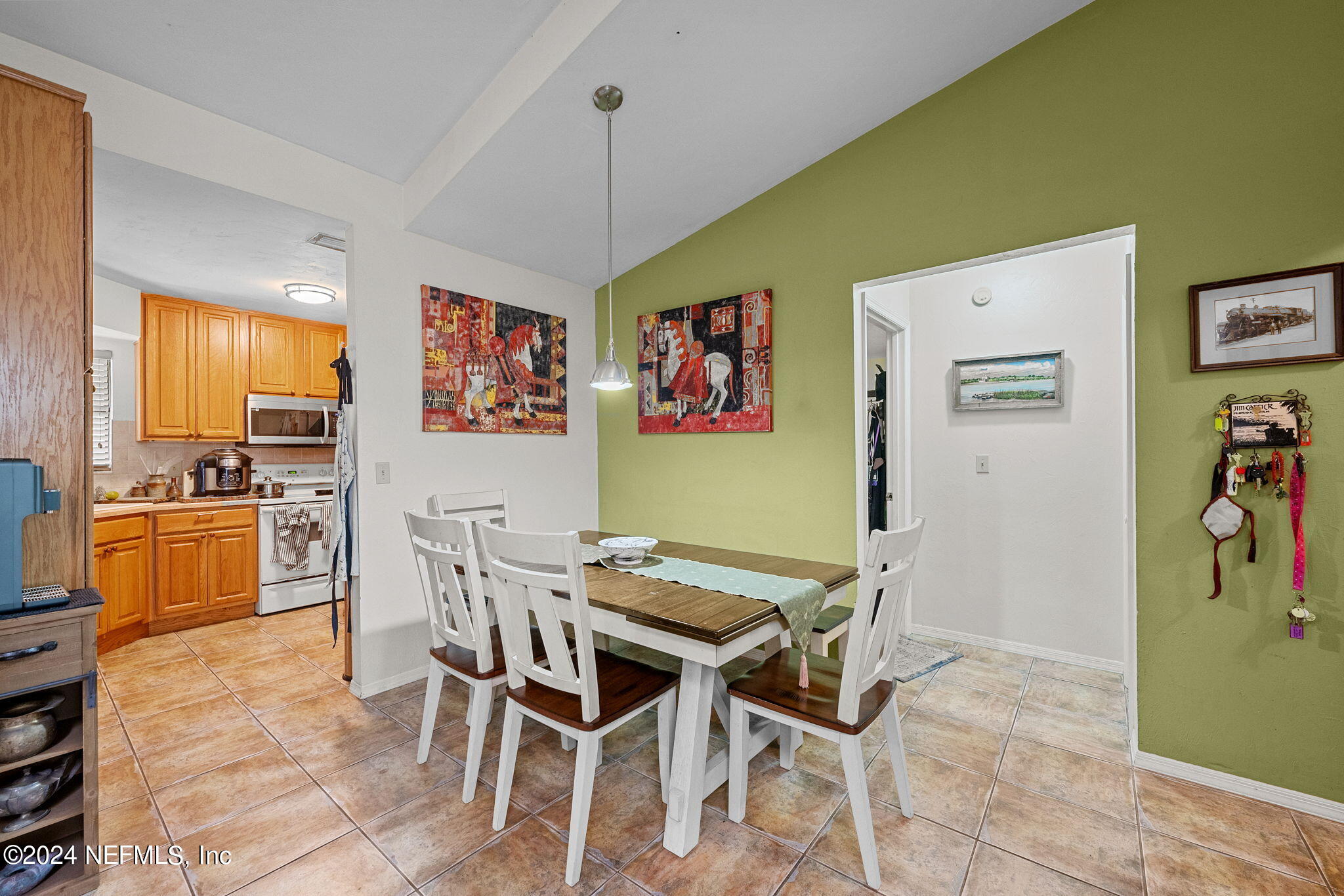529 Fox Hollow Lane St. Augustine, FL 32086 - Photo 6 of 18 a view of a dining room with furniture and a kitchen