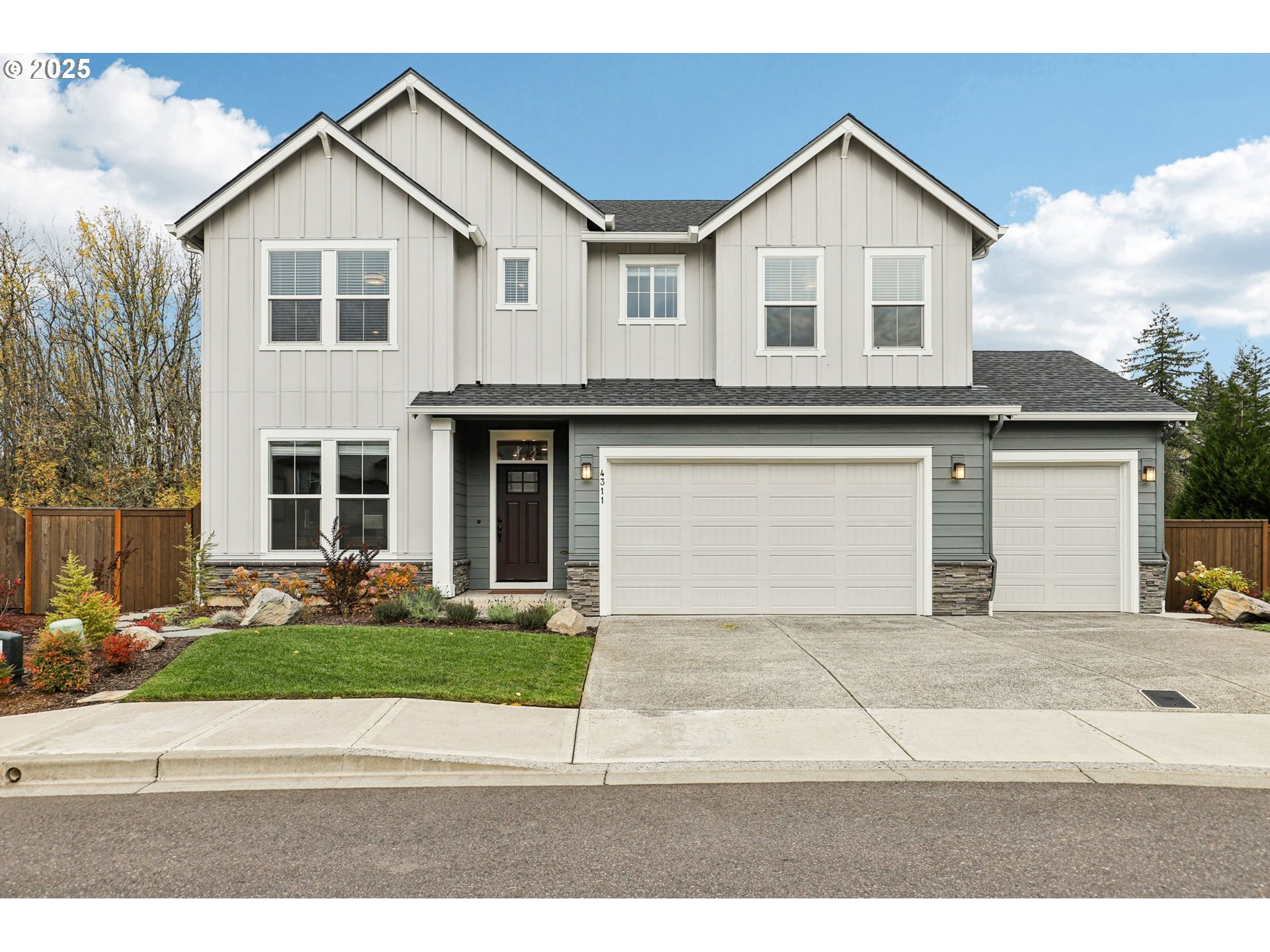 4311 Northwest Water Lily Place Camas, WA 98607 - Photo 1 of 1 a front view of a house with a yard and garage