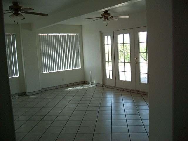 176 Camino Oceano Rio Rico, AZ 85648 - Photo 2 of 8 a view of an empty room with a window