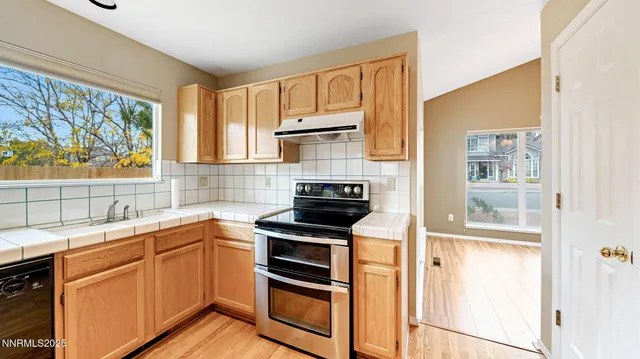 a kitchen with a sink stove and microwave