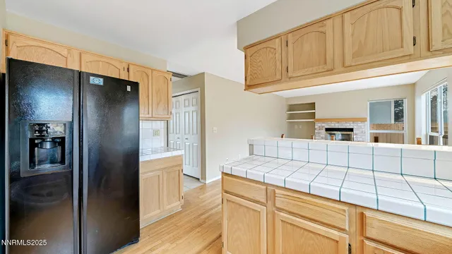 a kitchen with stainless steel appliances granite countertop a refrigerator and a stove
