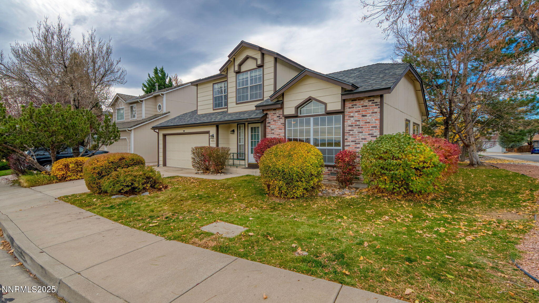 4690 Windcrest Drive Reno, NV 89523 - Photo 2 of 46 a front view of a house with garden