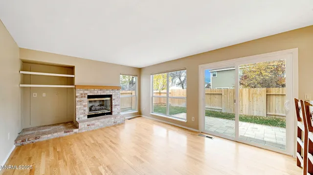 a spacious bedroom with a bed and a television
