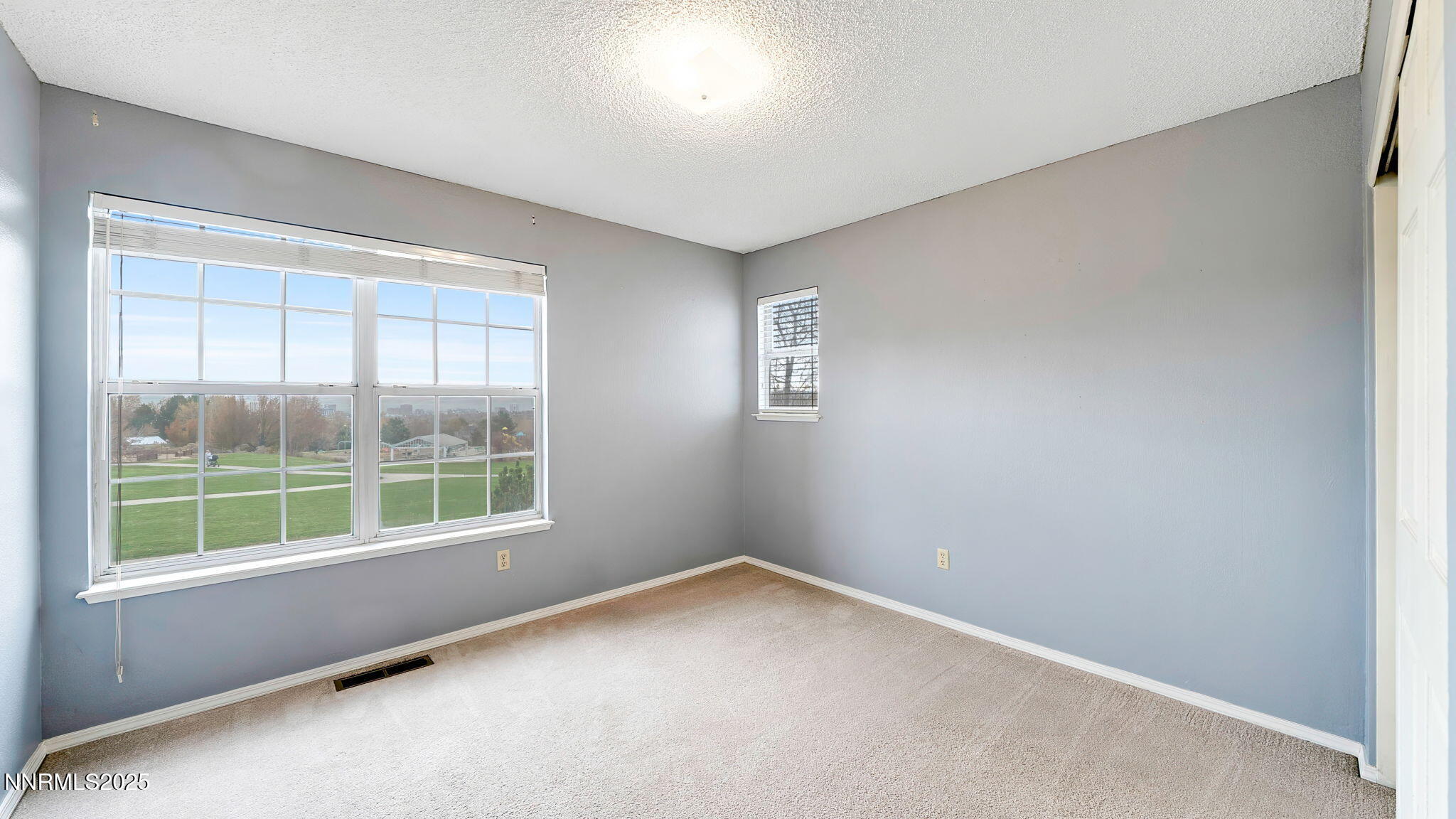 4690 Windcrest Drive Reno, NV 89523 - Photo 23 of 46 an empty room with windows