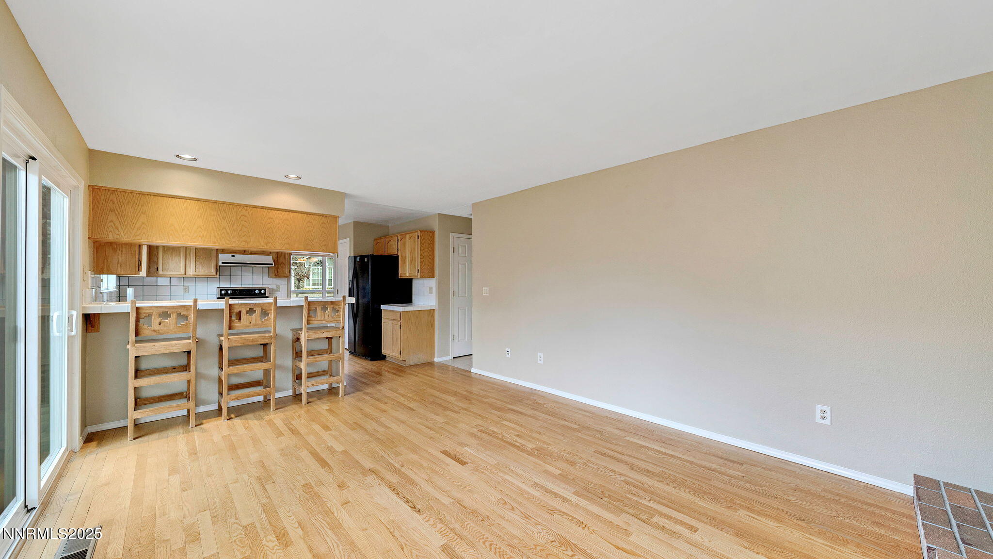 4690 Windcrest Drive Reno, NV 89523 - Photo 24 of 46 a view of a kitchen with wooden floor and kitchen