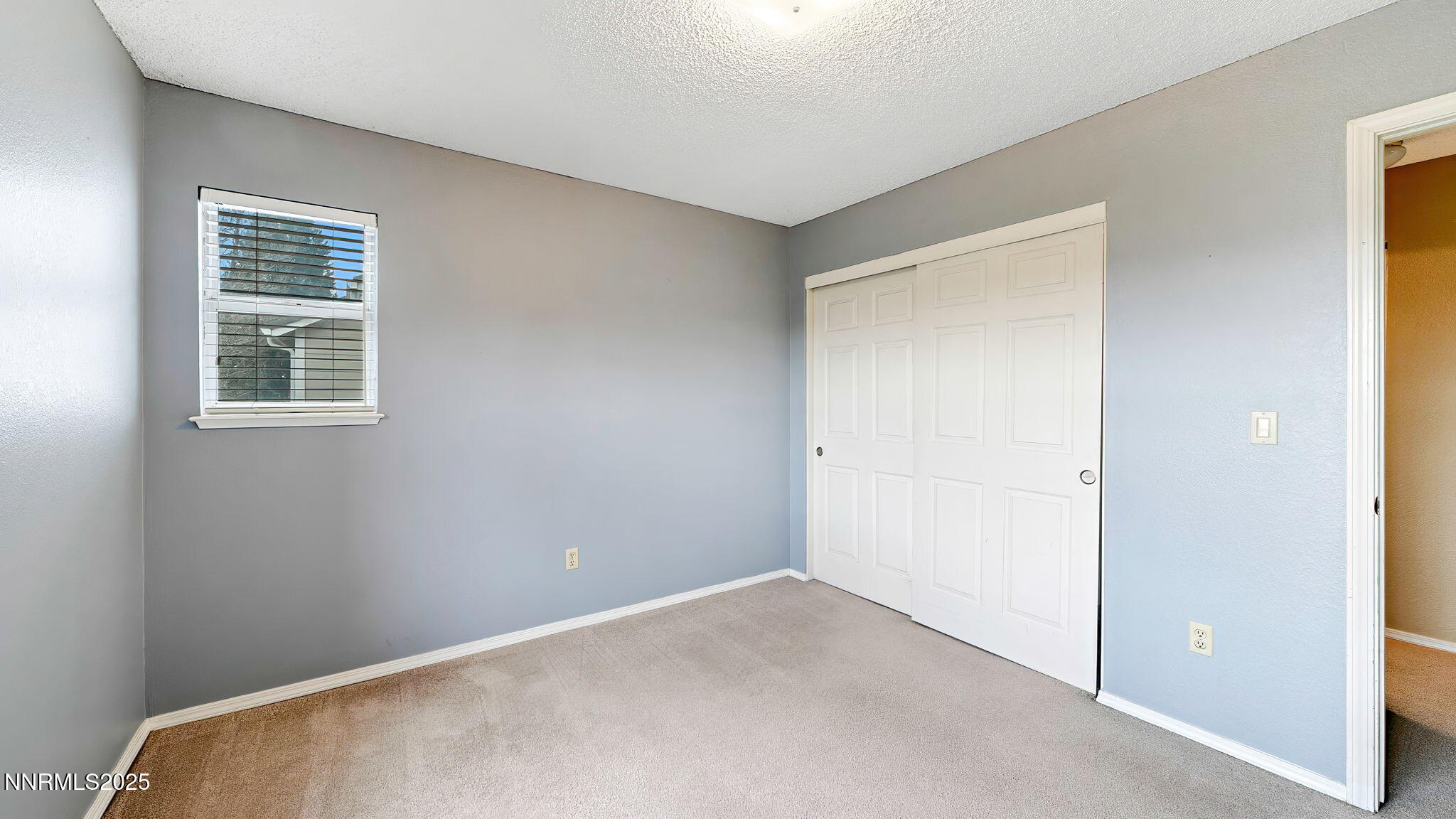 4690 Windcrest Drive Reno, NV 89523 - Photo 27 of 46 a view of an empty room with a window
