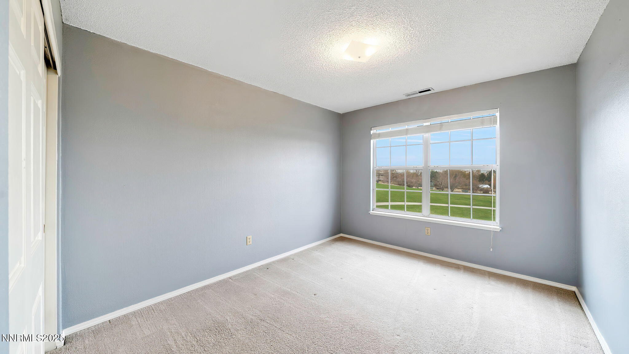 4690 Windcrest Drive Reno, NV 89523 - Photo 33 of 46 an empty room with windows