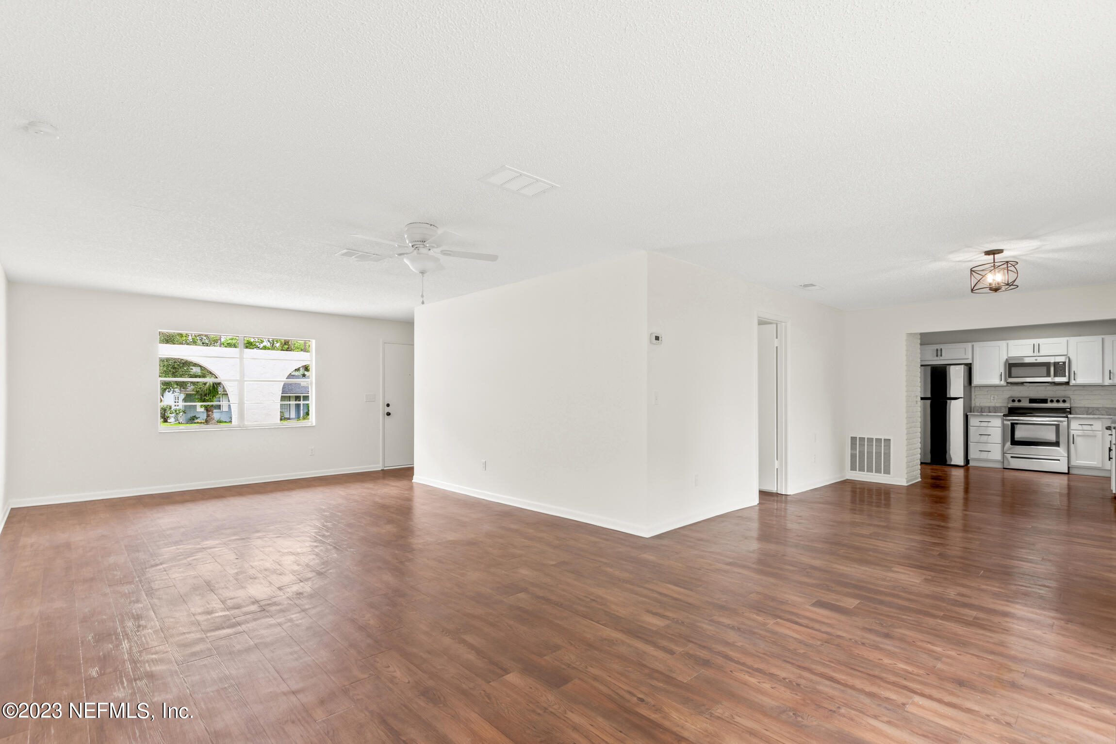 968 Espinado Avenue St. Augustine, FL 32086 - Photo 17 of 41 a view of empty room with wooden floor