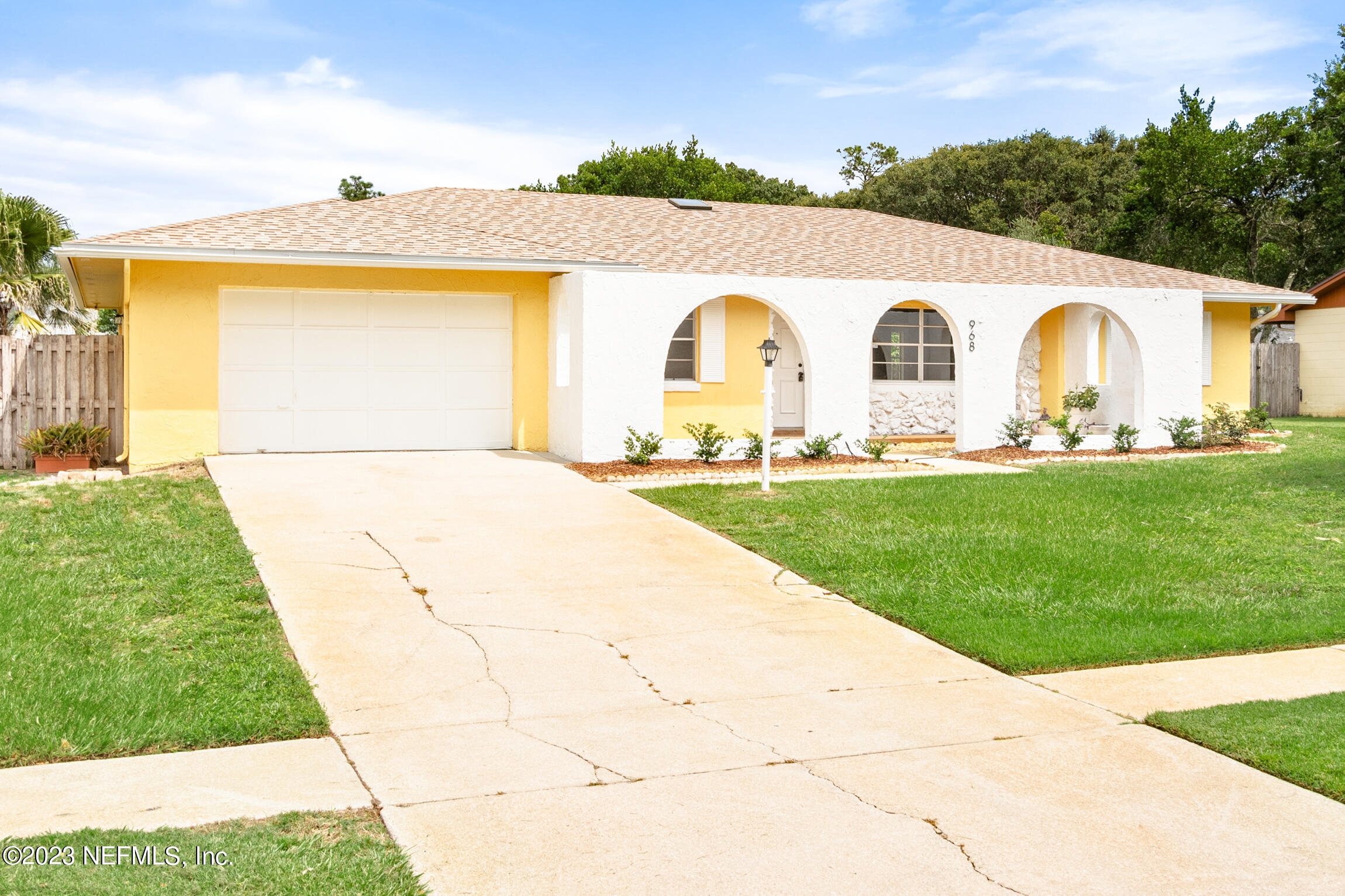 968 Espinado Avenue St. Augustine, FL 32086 - Photo 2 of 41 a front view of house with garden
