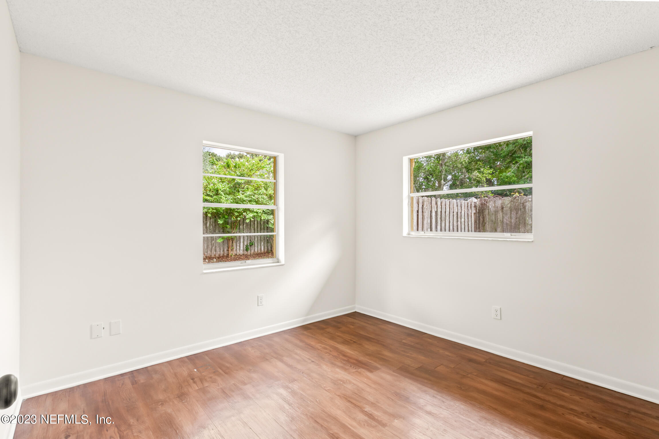 968 Espinado Avenue St. Augustine, FL 32086 - Photo 23 of 41 a view of an empty room with wooden floor and a window