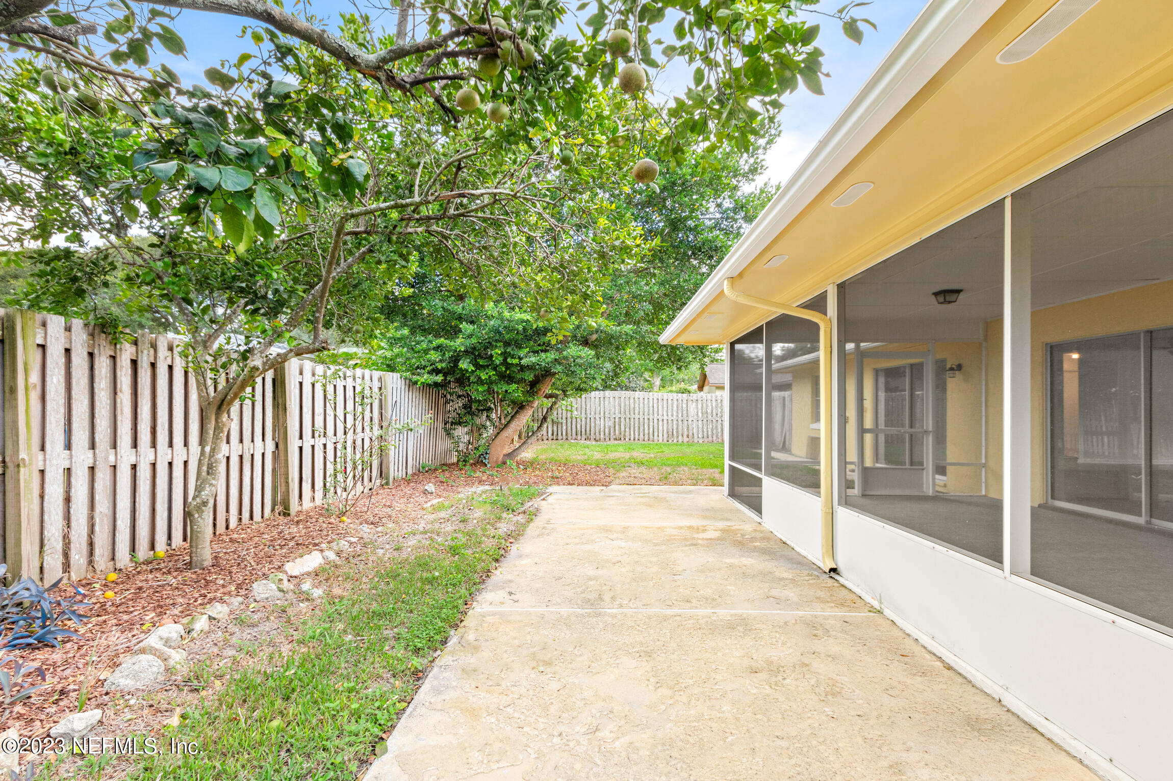 968 Espinado Avenue St. Augustine, FL 32086 - Photo 31 of 41 a view of a house with backyard and sitting area