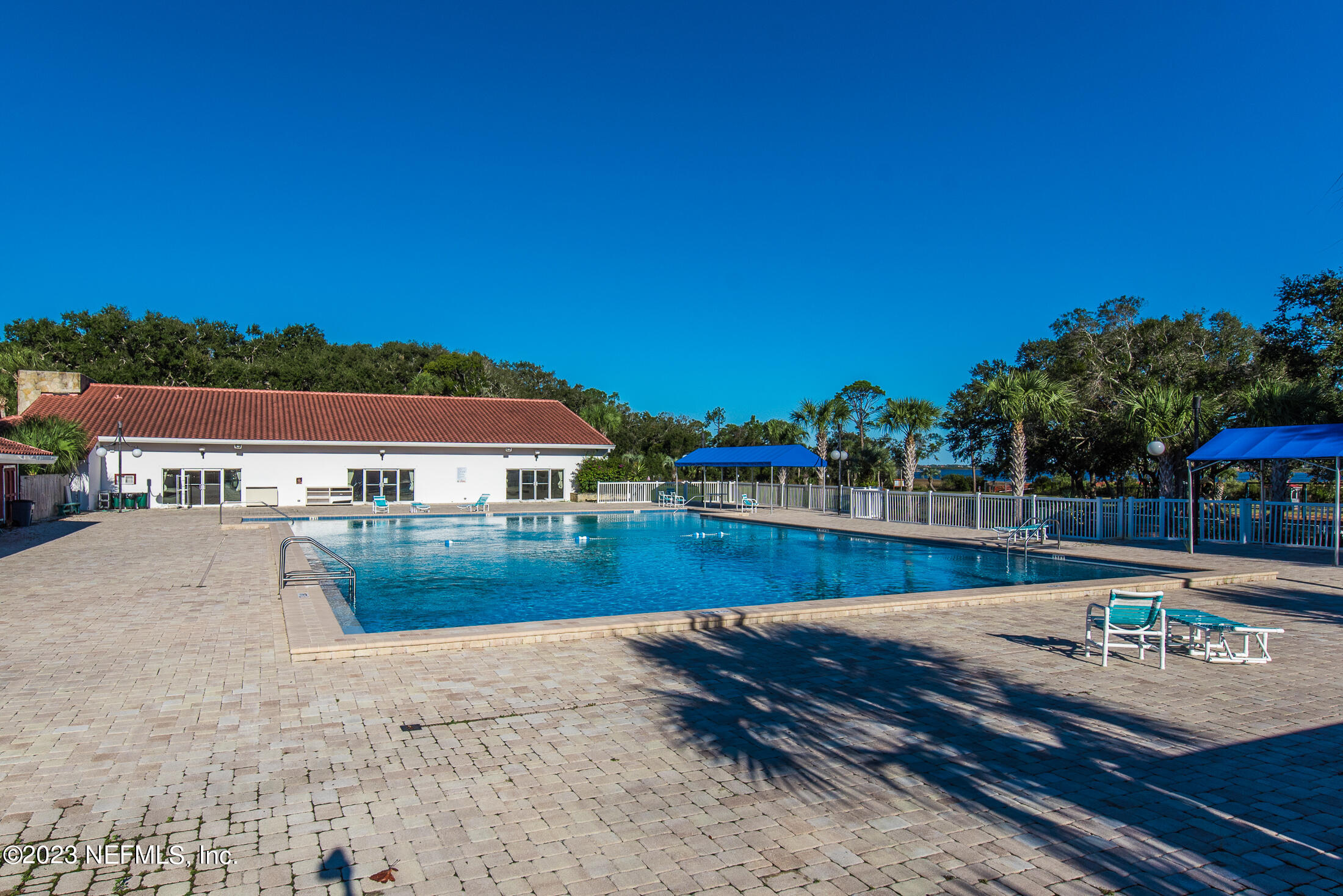 968 Espinado Avenue St. Augustine, FL 32086 - Photo 36 of 41 a view of a swimming pool with a patio