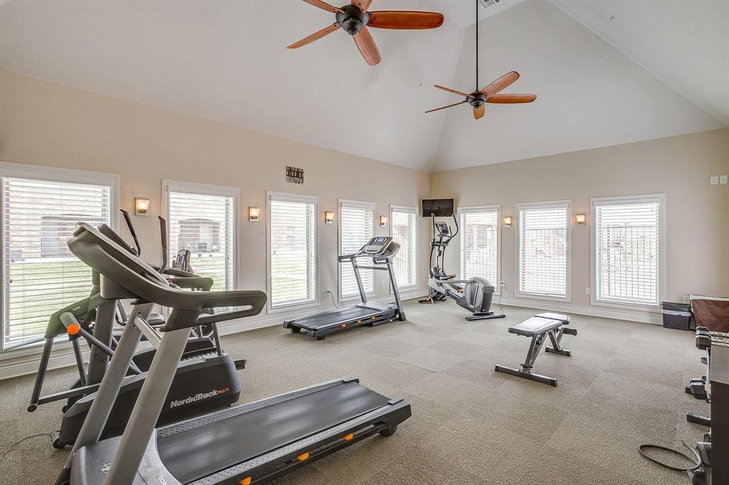 301 County Road 207, Unit 1110 Alvarado, TX 76009 - Photo 17 of 25 a room with gym equipment and windows