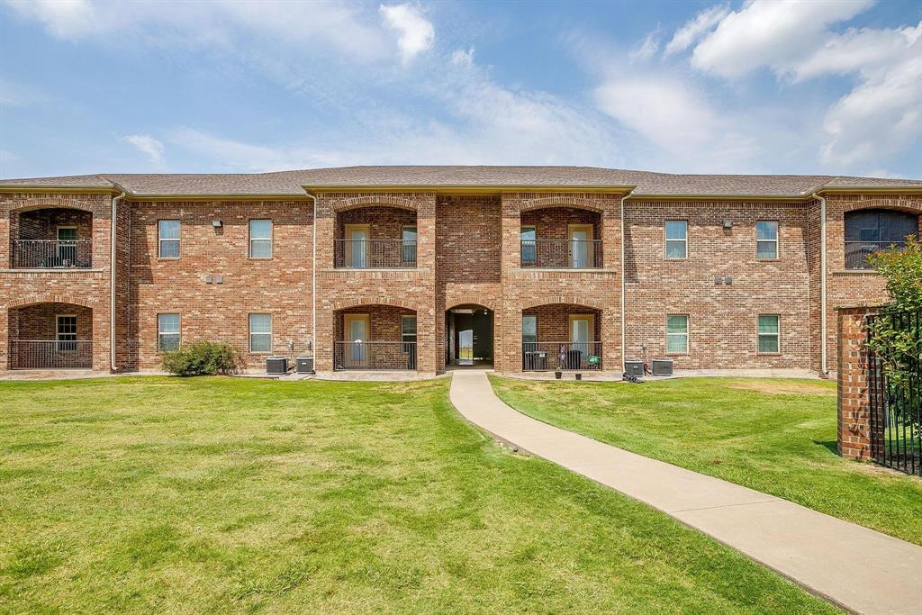 301 County Road 207, Unit 1110 Alvarado, TX 76009 - Photo 6 of 25 a front view of a house with a garden