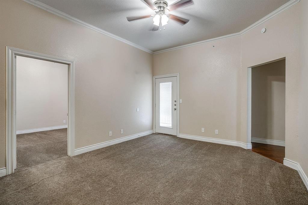 301 County Road 207, Unit 1110 Alvarado, TX 76009 - Photo 7 of 25 a view of an empty room with chandelier fan
