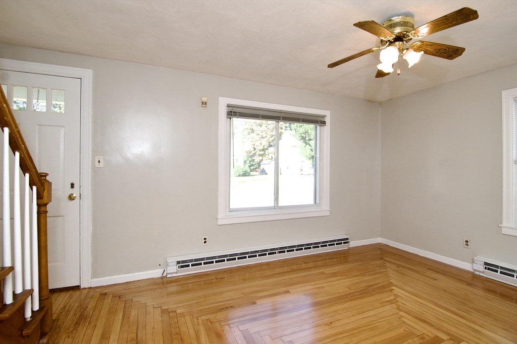 25 Chudy Street Three Rivers, MA 01080 - Photo 12 of 42 a view of a room with a window and a ceiling fan