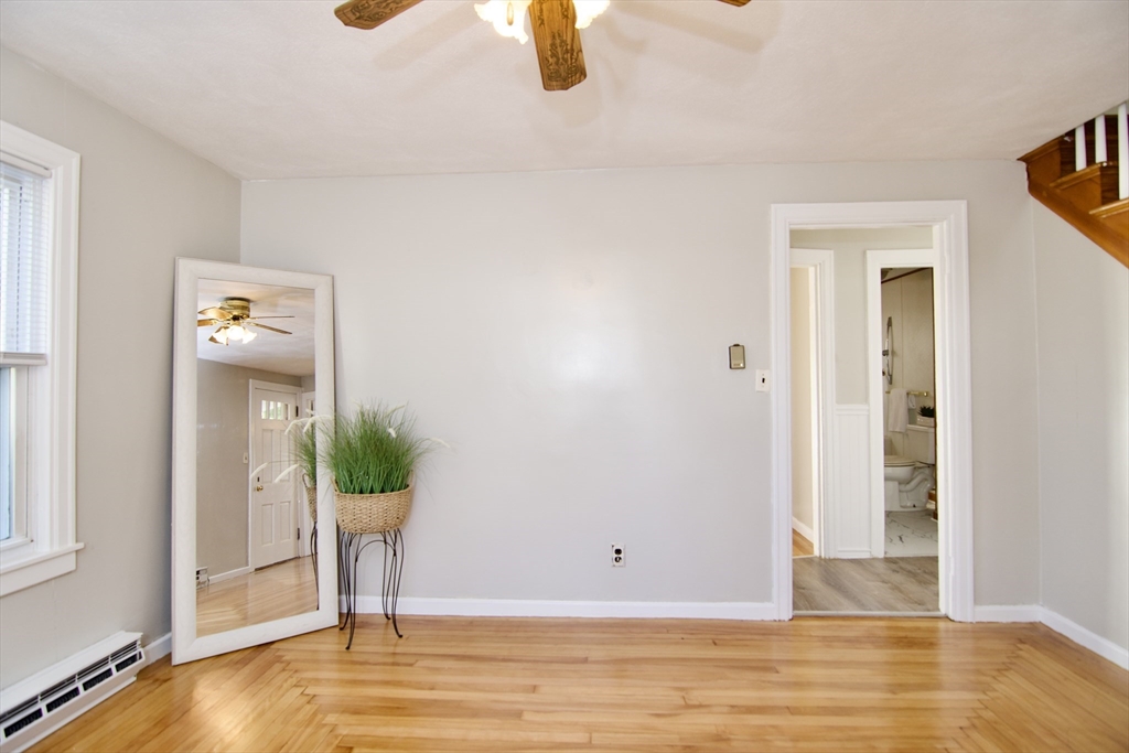 25 Chudy Street Three Rivers, MA 01080 - Photo 14 of 42 a view of empty room with wooden floor and windows