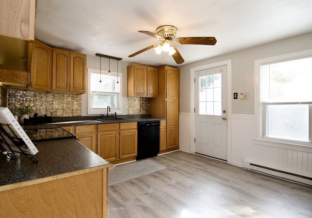25 Chudy Street Three Rivers, MA 01080 - Photo 17 of 42 a kitchen with stainless steel appliances granite countertop a sink a stove and a refrigerator